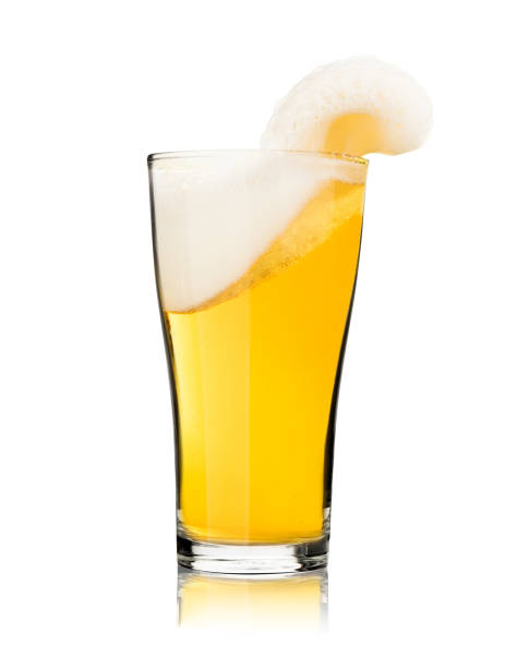 Beer in glass with froth foam splash isolated on white background stop motion celebration photo object design Beer in glass with froth foam splash isolated on white background stop motion celebration photo object design beer glass splash stock pictures, royalty-free photos & images