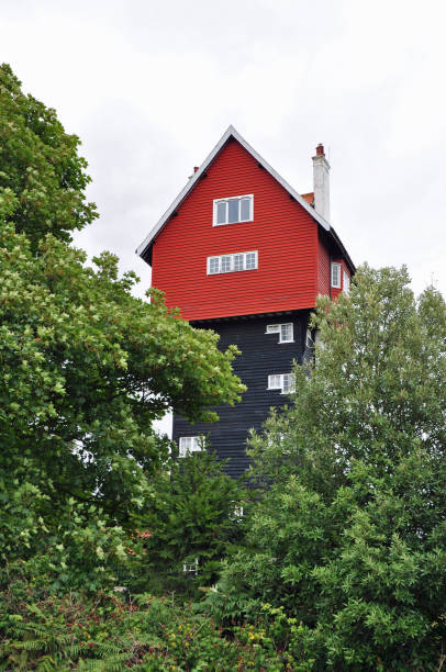 Iconic House in the Clouds seen close up through trees. Old water pumping station converted to residential accommodation. Thorpeness, Suffolk, United Kingdom, August 16, 2019