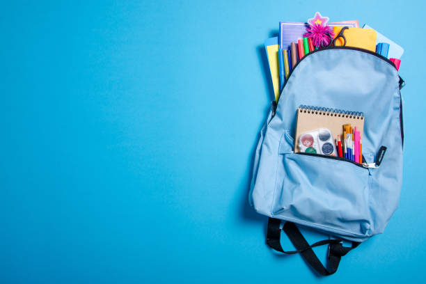 istock Back to school concept. Blue backpack with school supplies 1171518930