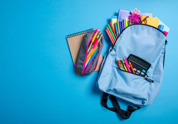 istock Back to school concept. Blue backpack with school supplies 1171518934