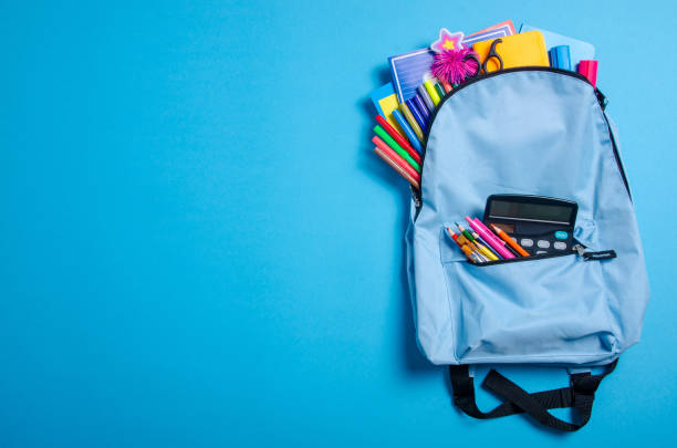 istock Back to school concept. Blue backpack with school supplies 1171518963