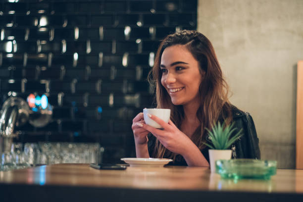 istock Charming woman drinking cappuccino 1171519205