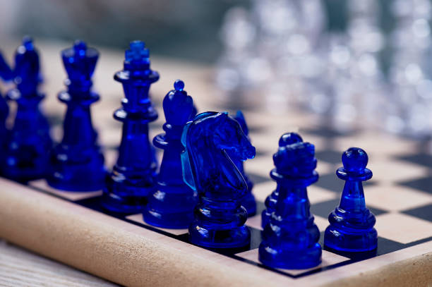 istock blue chess.Knight on the chessboard. Closely 1171519236