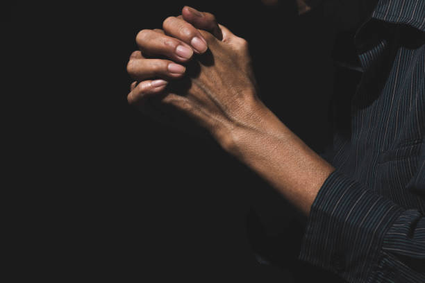 istock Hand of man while praying for religion. Concept peace and life. 1171520127