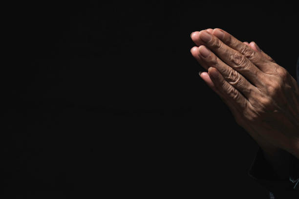 istock Hand of man while praying for religion. Concept peace and life. 1171520148