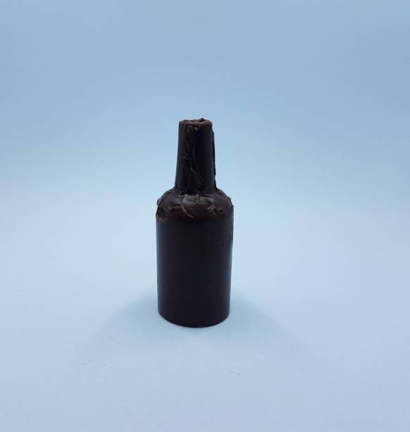 istock brown chocolate bottle candy on white background 1171524100