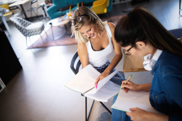 istock Group of young students are studying together in university 1171525420