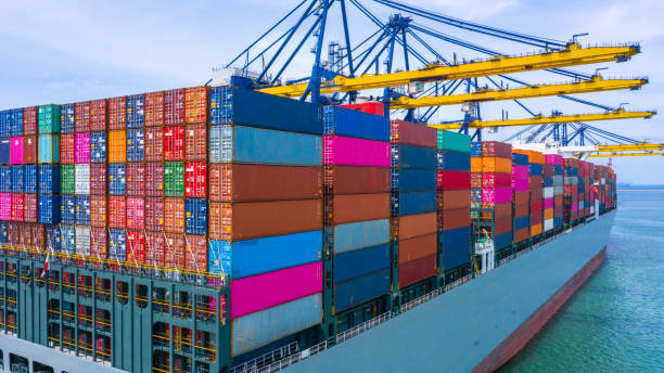 istock Freight shipping containers at the docks, Stack of containers in a container ship at deep sea port. 1171526874