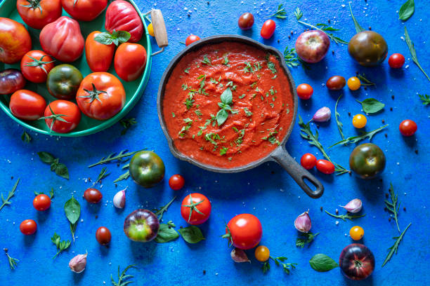 Fried tomato sauce with tomatoes on wood