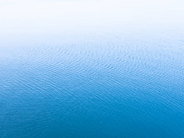 istock Unique blue background. Blue sea water surface texture background with white copy space on top. 1171530873