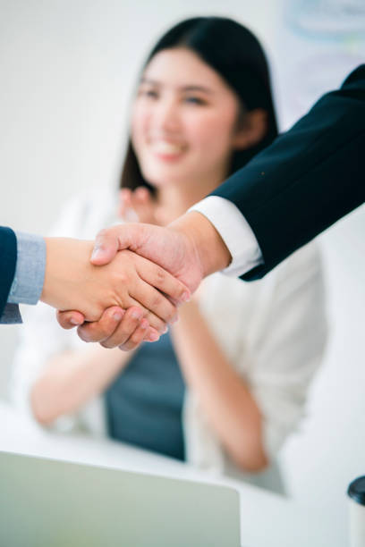 istock business successful contract agreement two businessman handshake with confident and powerful mission achievement white background 1171532723