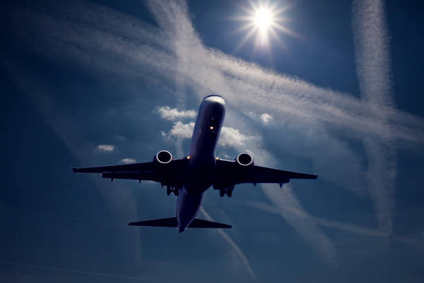 istock Plane in the sky with chem trails. Environmental pollution concept 1171537177