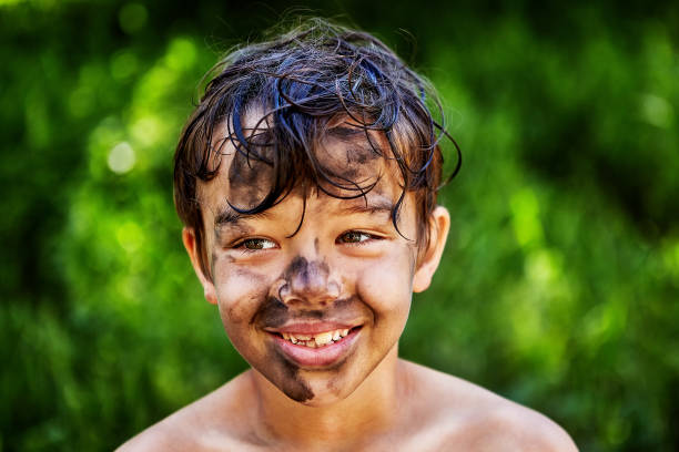 istock A smiling boy got his face dirty. 1171538291
