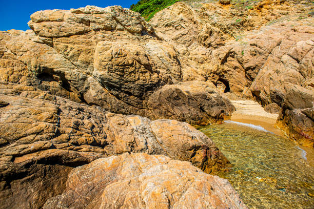 Crystal clear sea and the picturesque rocky beach in Skiathos, Greece