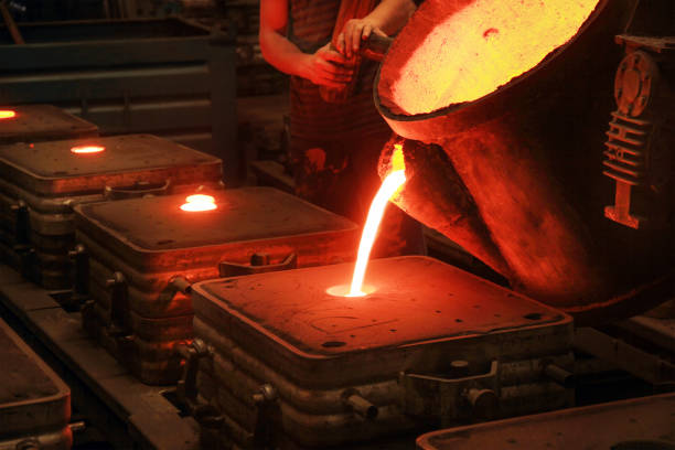 istock Casting, melting, molding and foundry. The most widely used non reusable mold method is sand casting a process in which specially treated sand is rammed around the pattern and placed in a support. 1171544689