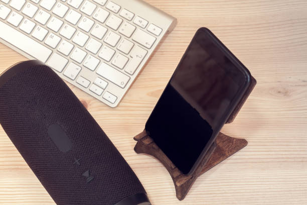 istock portable speaker with mobile phone and keyboard 1171549813