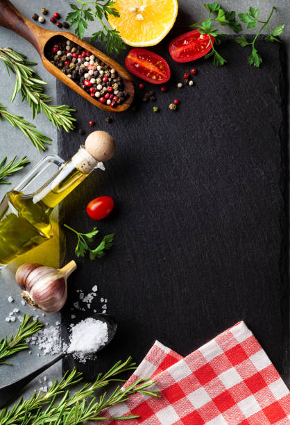 istock Culinary background with kitchen slate board, herbs and aromatic spices. Empty place for menu or recipe. Top view. 1171549932