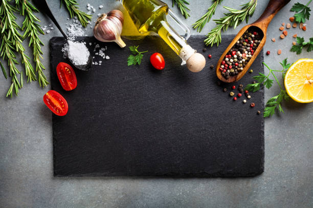 istock Culinary background with kitchen slate board and aromatic spices. Empty place for menu or recipe. Top view. 1171549983