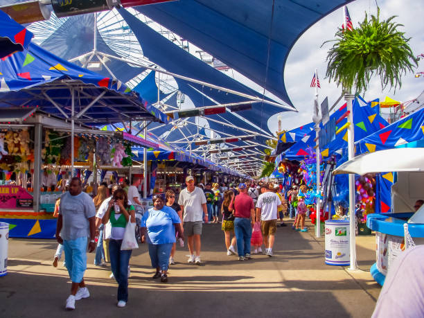 Vistors enjoy food, games and the festivities of the State Fair of Texas in Dallas.