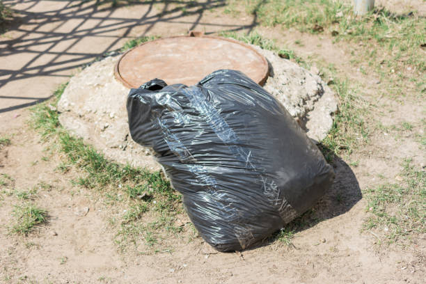 istock Environmental pollution. People left debris in wildlife. Garbage dump on the grass near the forest  polluting nature and city park with litter and junk. Nature protection, care. 1171554672