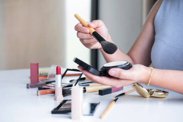 istock Elegant female Beauty blogger showing testing beauty cosmetic using product makeup tutorial cosmetics and sale product 1171554750