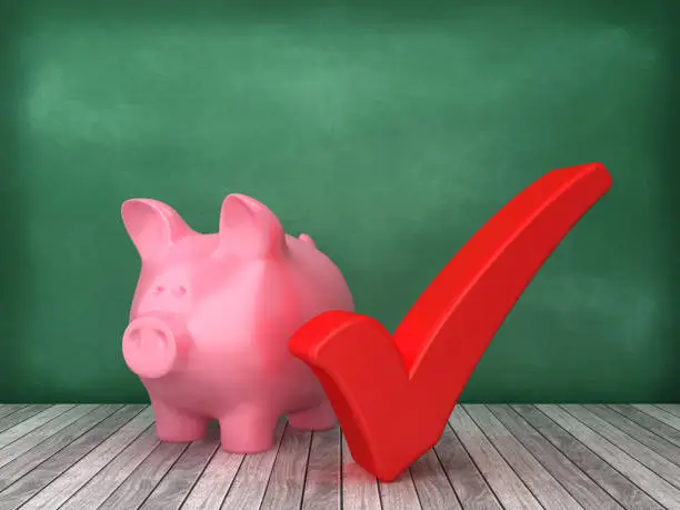 Photo of Piggy Bank with Check Mark on Chalkboard Background - 3D Rendering