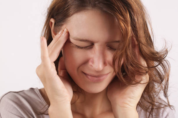 istock Studio shot of a young woman suffering from headache 1171562882