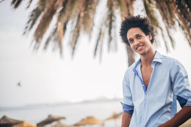 istock Young man with afro hairstyle 1171565308