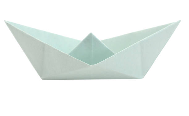 istock Origami green paper boat on white background 1171565646