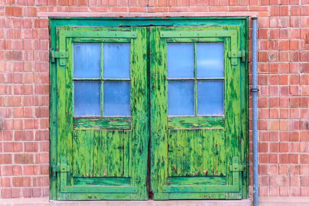 istock An old rotten door with green splintered paint 1171565743