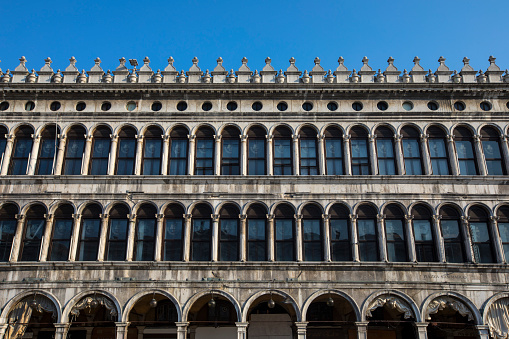 A view of the exterior of Procuratie Vecchie - one of the three connecting buildings on Piazza San Marco, or St. Marks Square, in Venice, Italy.
