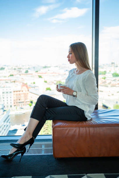istock Businesswoman drinking coffee 1171569039