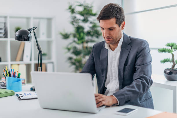 istock Businessman at the office working on laptop 1171571506