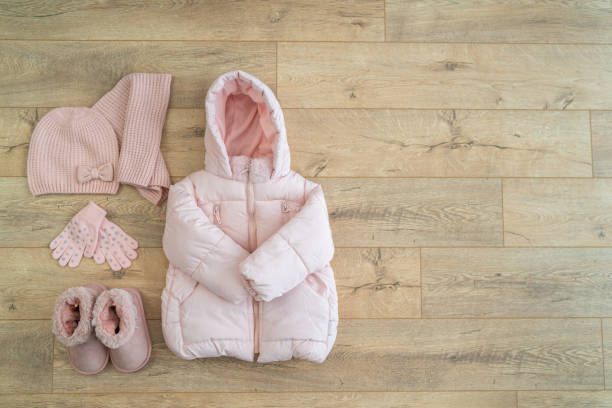 istock Children's winter clothes: warm  jacket, hat, mittens, boots 1171574574
