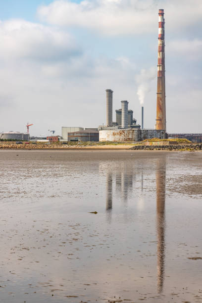 istock Power plant in Dublin port and Poolbeg beach 1171574977