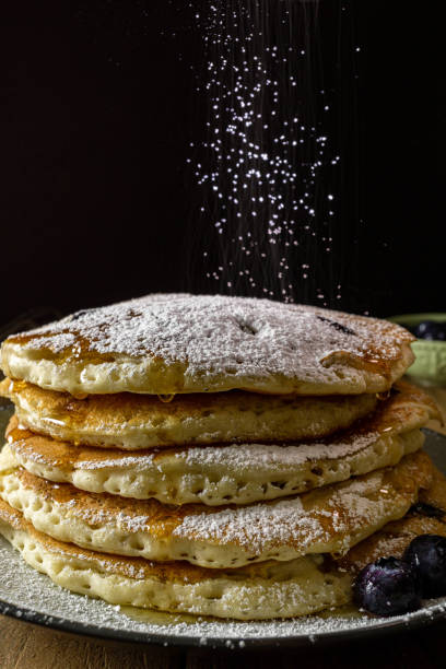 istock Blueberry pancakes with honey and powder sugar. 1171582831