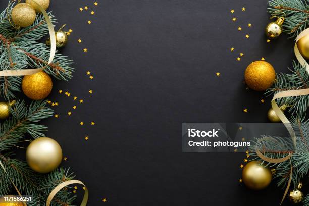 Black Christmas Background With Golden Decorations Baubles Fir Tree Branches Confetti Christmas Holiday Celebration Winter New Year Concept Christmas Banner Mockup Greeting Card Template Stock Photo - Download Image Now