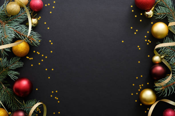 istock Black Christmas background with festive decorations, baubles, fir tree branches, confetti. Christmas holiday celebration, winter, New Year concept. Christmas banner mockup, greeting card template. 1171586264