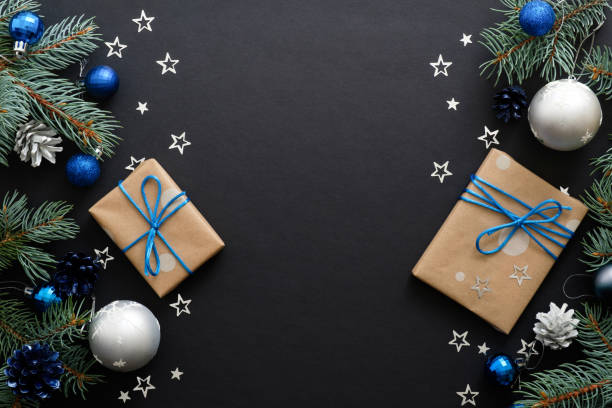 istock Christmas frame with blue and sliver modern decorations, baubles, fir tree branches, gift boxes on dark black background. Elegant Christmas banner mockup, greeting card template 1171586274