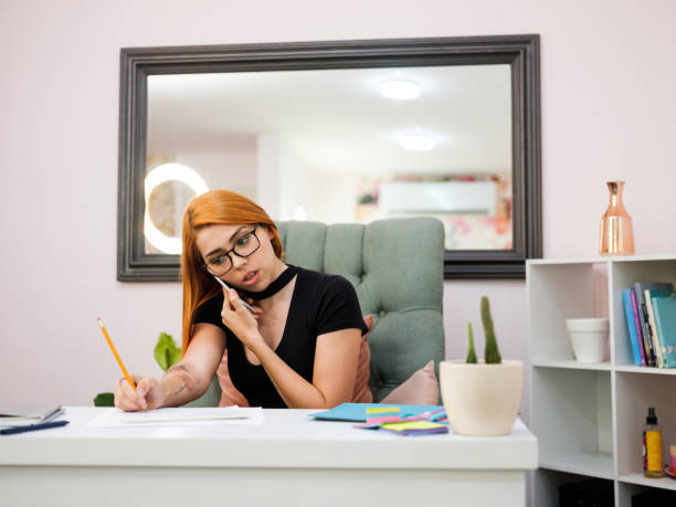 istock Young businesswoman sitting and using phone 1171592285