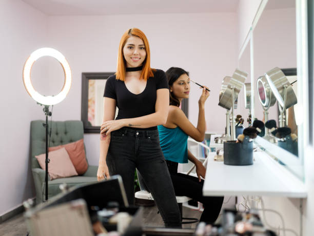 istock Attractive latin make-up artist standing and smiling at camera 1171592325