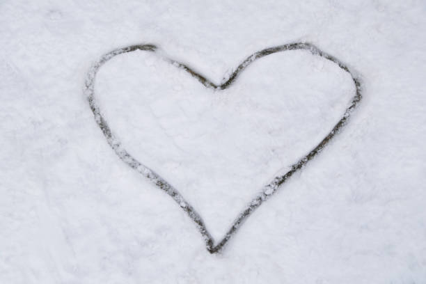 istock Heart drawn in the white snow 1171592402