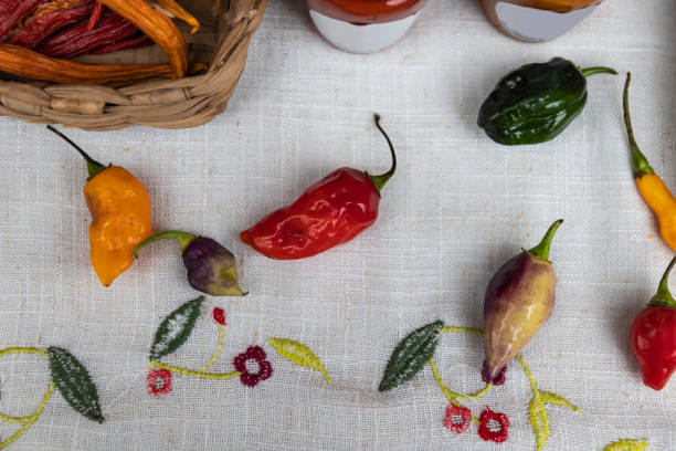 istock Table with peppers. Tablecloth with chili peppers. 1171607206