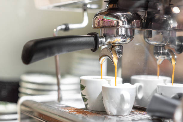 istock Espresso pouring from espresso coffee machine. Hot beverages. Two espresso pouring from espresso coffee machine. Hot beverages, coffee preparation and barista. 1171608026