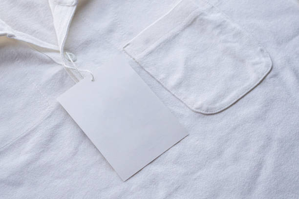 istock Blank white clothes tag label on new shirt 1171612744
