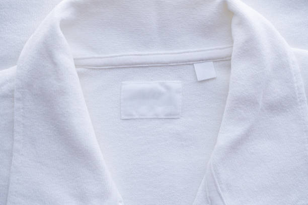 istock Blank white clothes label on new shirt background 1171612745