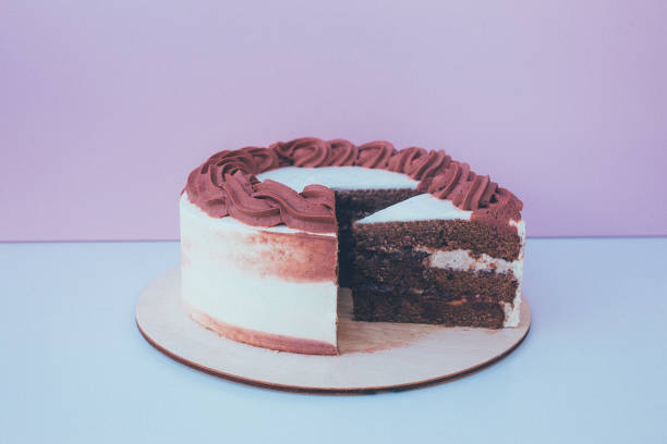 istock a cut of cake with whipped cream on the table background. 1171612790
