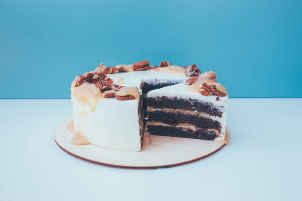 istock a cut of cake with whipped cream on the table background. 1171612791