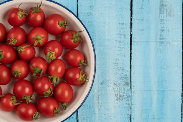 istock ripe cherry tomatoes on a wooden table 1171622189