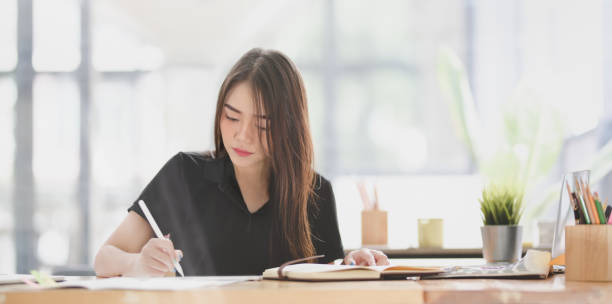 istock Beautiful young designer editing her concept with tablet 1171623952